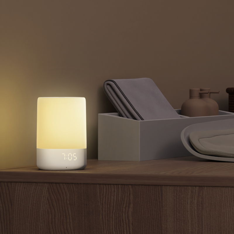 lifestyle image of sound and light with yellow light on bedside
